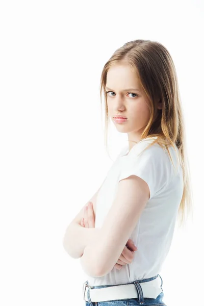 Offended teenage girl with crossed arms looking at camera isolated on white — Stock Photo