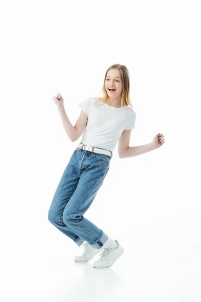 Happy teenage girl dancing isolated on white — Stock Photo