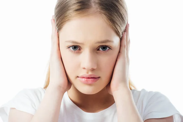 Offended teenage girl covering ears with hands isolated on white — Stock Photo