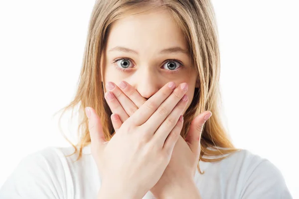 Scared teenage girl covering mouth with hands isolated on white — Stock Photo