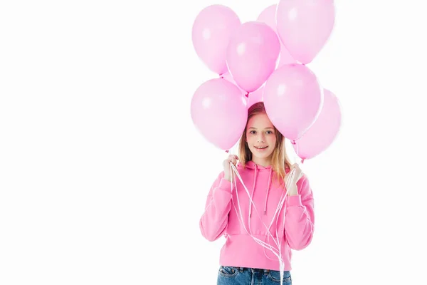 Happy teenage girl holding pink balloons isolated on white — Stock Photo