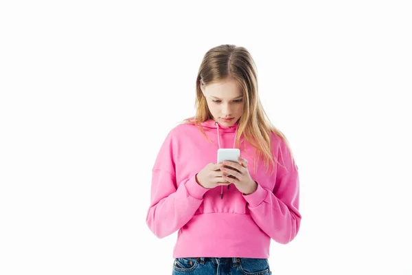 Teenage girl in pink hoodie using smartphone isolated on white with copy space — Stock Photo