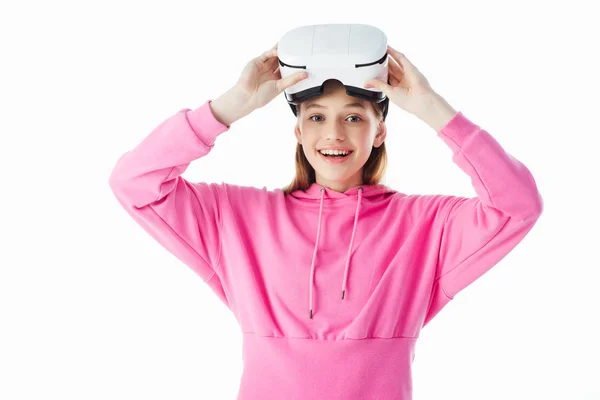 Happy teenage girl in pink holding vr headset isolated on white — Stock Photo