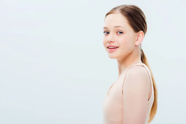 Happy teenage girl looking at camera isolated on grey — Stock Photo