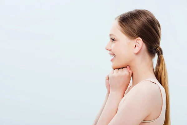 Side view of happy teenage girl isolated on grey — Stock Photo