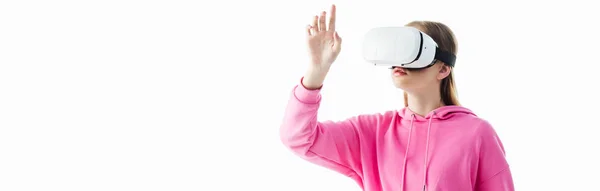 Panoramic shot of teenage girl in pink hoodie wearing vr headset isolated on white — Stock Photo