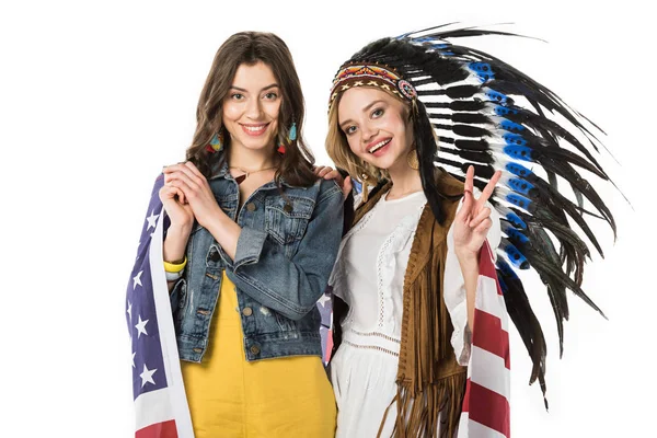 Two bisexual hippie girls holding american flag and showing peace sign isolated on white — Stock Photo