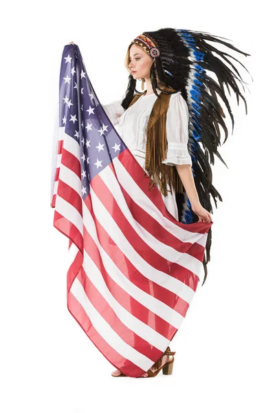 Full length view of happy hippie girl in indian headdress holding american flag isolated on white — Stock Photo