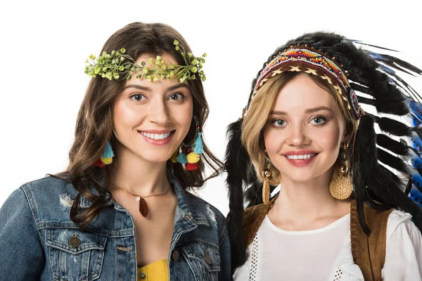 Two beautiful hippie girls in wreath and indian headdress isolated on white — Stock Photo