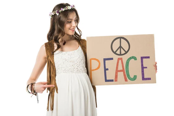 Pregnant hippie woman pointing with finger placard with inscription isolated on white — Stock Photo