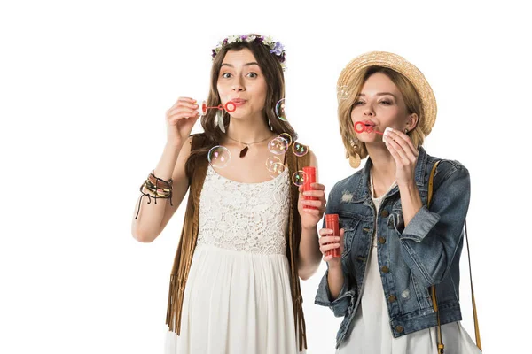 Bisexual hippie couple blowing soap bubbles isolated on white — Stock Photo