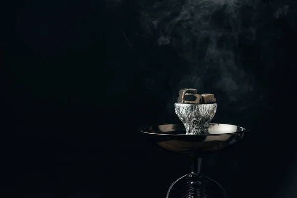 Hookah bowl with coals in smoke on black — Stock Photo