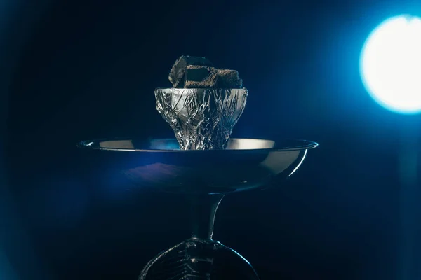 Hookah bowl with coals with blue illumination on black — Stock Photo