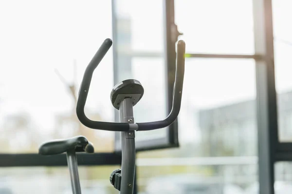 Selective focus of modern elliptical machine at sports center — Stock Photo