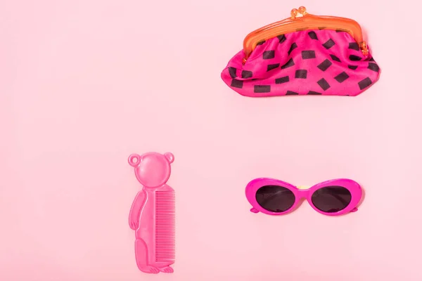Top view of organized accessories isolated on pink — Stock Photo