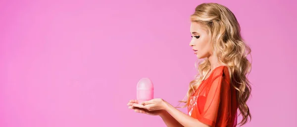 Beautiful girl with lamp posing isolated on pink, doll concept — Stock Photo