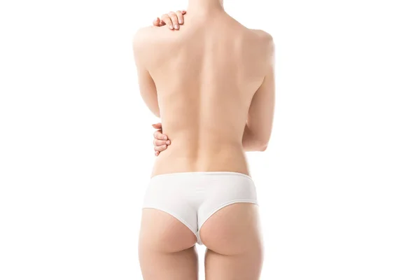 Vista trasera de mujer joven sexy en bragas aisladas en blanco - foto de stock