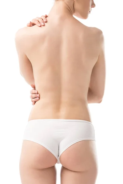 Vista trasera de mujer joven sexy en bragas aisladas en blanco - foto de stock