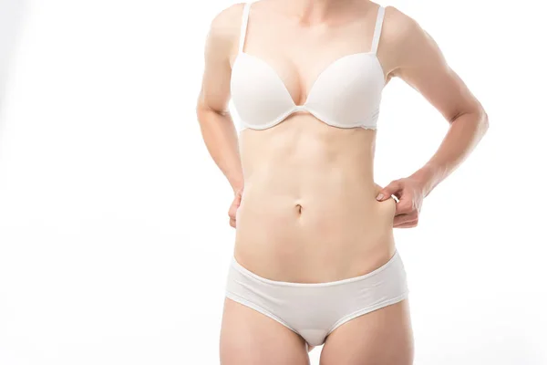 Partial view of woman in underwear with excess weight isolated on white — Stock Photo