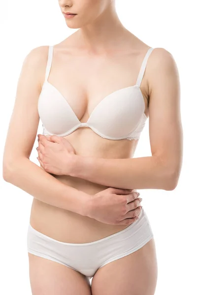 Частковий вид сексуальної молодої жінки в нижній білизні ізольовані на білому — стокове фото
