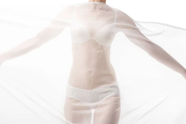 Частичный вид сексуальной женщины в нижнем белье с белой тканью изолированы на белом — стоковое фото