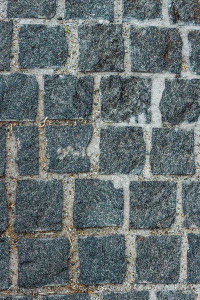 Top view of black paving stones on road in city — Stock Photo