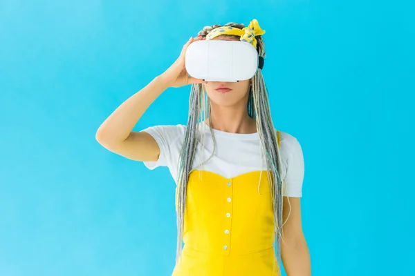 Girl with dreadlocks in virtual reality headset isolated on turquoise — Stock Photo