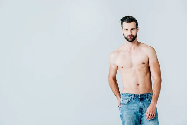 Shirtless handsome man in jeans posing isolated on grey with copy space — Stock Photo