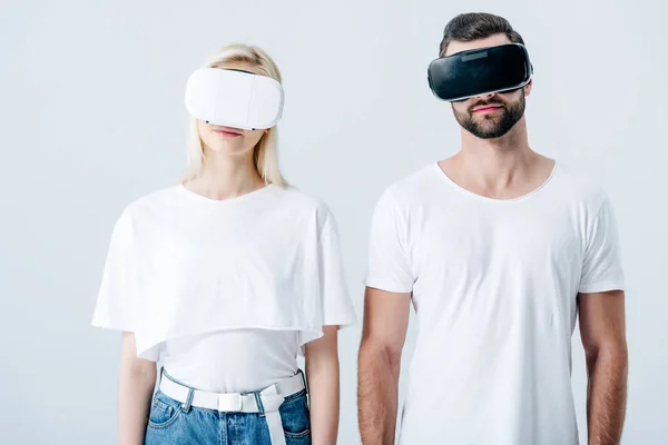 Man and girl in Virtual reality headsets isolated on grey — Stock Photo