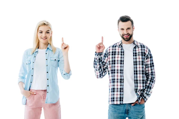 Glücklich Mädchen und Mann zeigt mit den Fingern nach oben isoliert auf weiß — Stockfoto