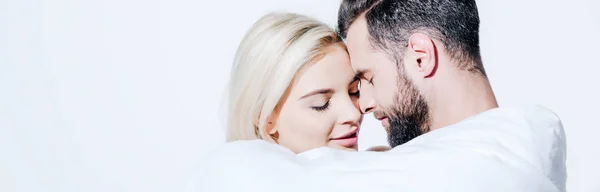 Panoramic shot of girlfriend and boyfriend covered in blanket touching with foreheads isolated on white — Stock Photo