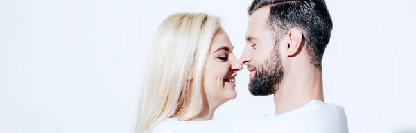 Panoramic shot of girlfriend and boyfriend covered in blanket on white — Stock Photo