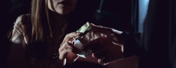 Panoramic shot of woman with dollar banknotes buying drugs from thug — Stock Photo