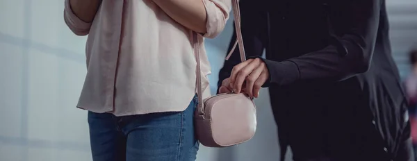 Panoramic shot of thief stealing money from bag of woman — Stock Photo