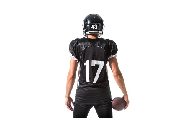 Vista posterior del jugador de fútbol americano con pelota aislada en blanco - foto de stock