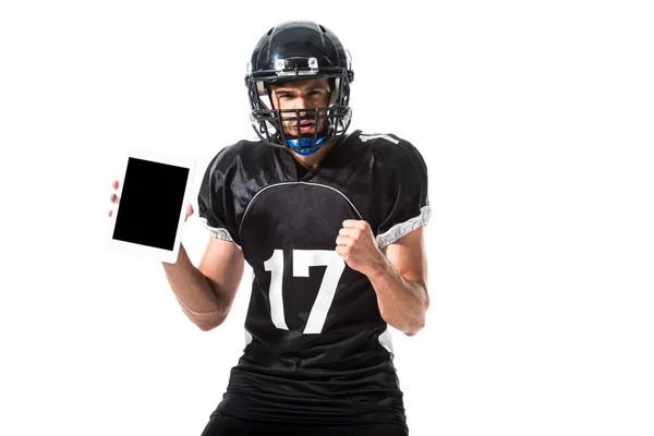 Jugador de fútbol americano con tableta digital y mano apretada aislada en blanco - foto de stock