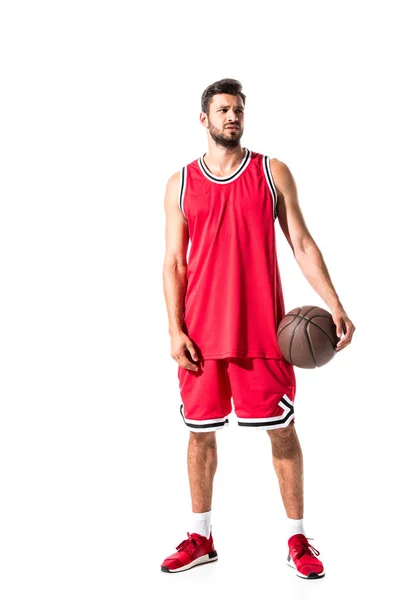 Баскетболист смотрит в сторону Isolated On White — стоковое фото