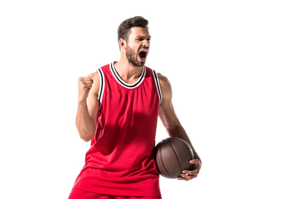 Joueur de basket en uniforme avec balle acclamant avec la main serrée isolé sur blanc — Photo de stock