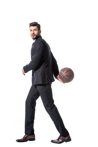 Handsome businessman in formal wear holding basketball Isolated On White — Stock Photo