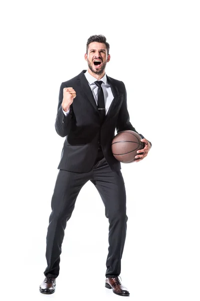 Excitado hombre de negocios en ropa formal con baloncesto y mano apretada aislado en blanco - foto de stock