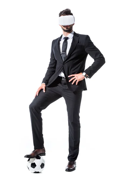 Businessman in virtual reality headset standing on soccer ball Isolated On White — Stock Photo