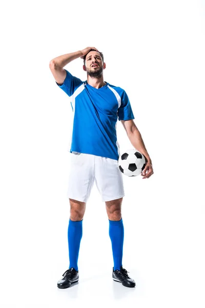 Giocatore di calcio deluso con palla e mano sulla testa isolato su bianco — Foto stock