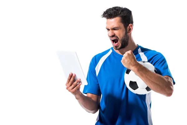 Beau joueur de football avec ballon et tablette numérique acclamant isolé sur blanc — Photo de stock
