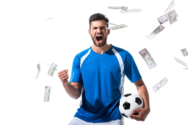 Soccer player with ball cheering with clenched hand near falling money Isolated On White — Stock Photo