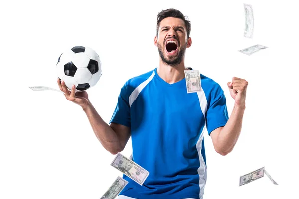 Urlando giocatore di calcio con palla e laptop vicino a cadere soldi isolato su bianco — Foto stock