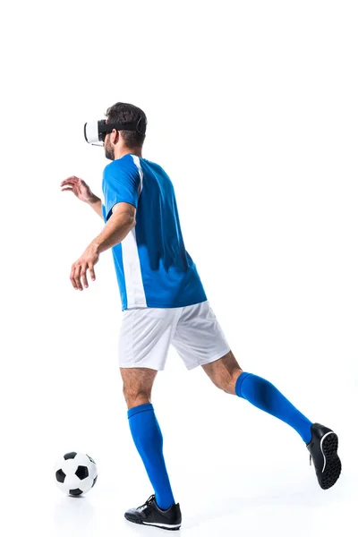 Back view of soccer player in virtual reality headset training with ball Isolated On White — Stock Photo