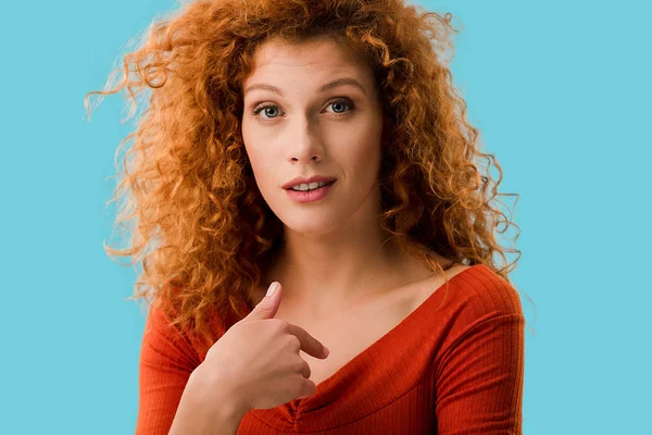 Beautiful redhead girl pointing at herself isolated on blue — Stock Photo