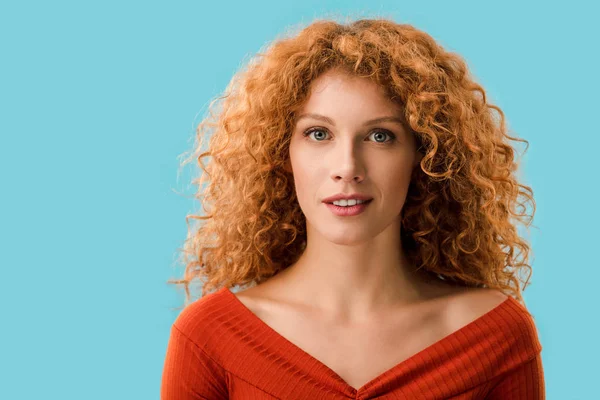 Portrait of attractive redhead girl isolated on blue — Stock Photo