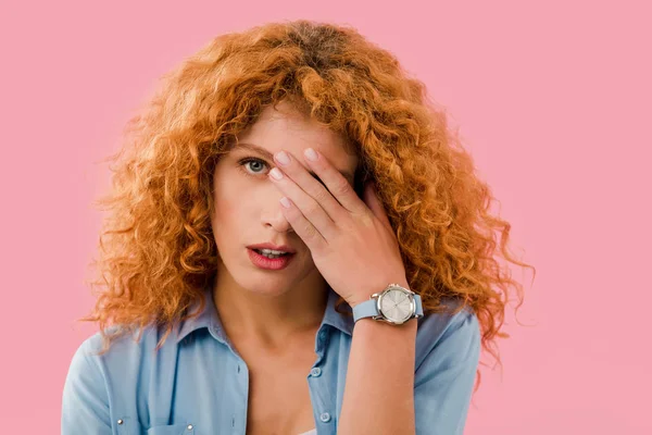Exhausted redhead young woman isolated on pink — Stock Photo