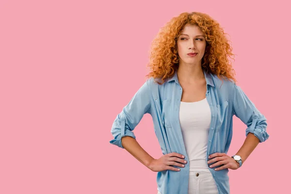 Attractive pensive redhead woman isolated on pink — Stock Photo